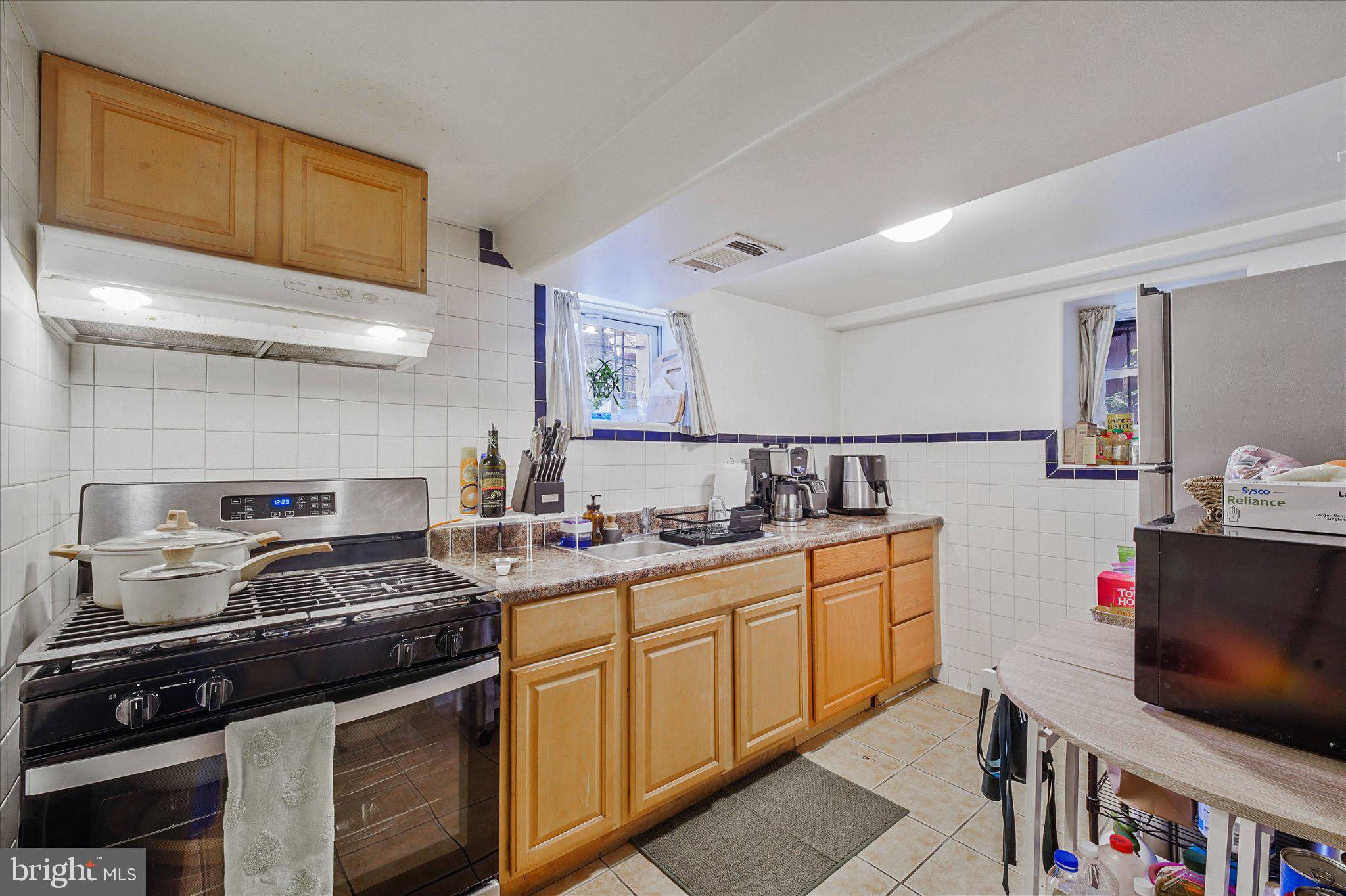 3113 11th Street Northwest Washington, DC 20010 - Photo 29 of 42 Cozy kitchen with modern finishes.