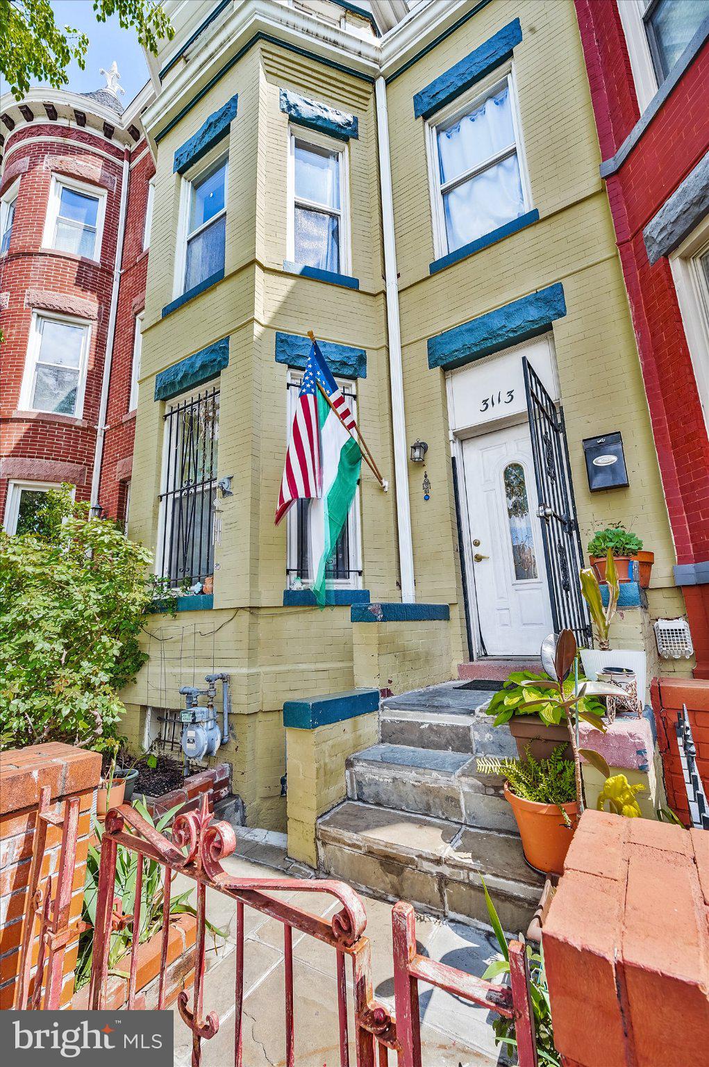 3113 11th Street Northwest Washington, DC 20010 - Photo 4 of 42 Charming facade with vibrant flags.