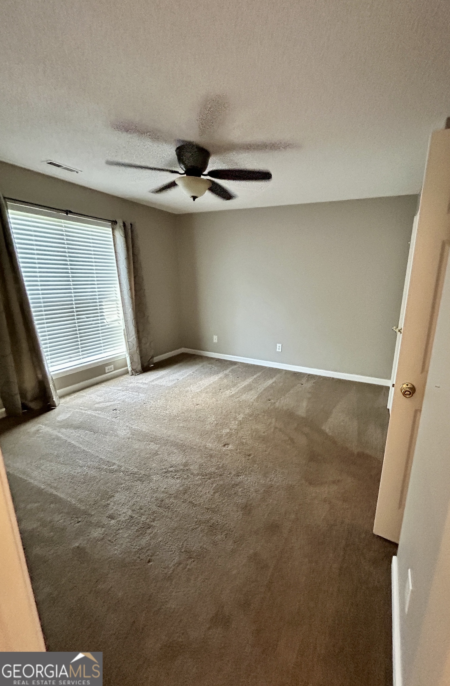 98 Pheasant Ridge Newnan, GA 30265 - Photo 19 of 23 a view of an empty room with a window