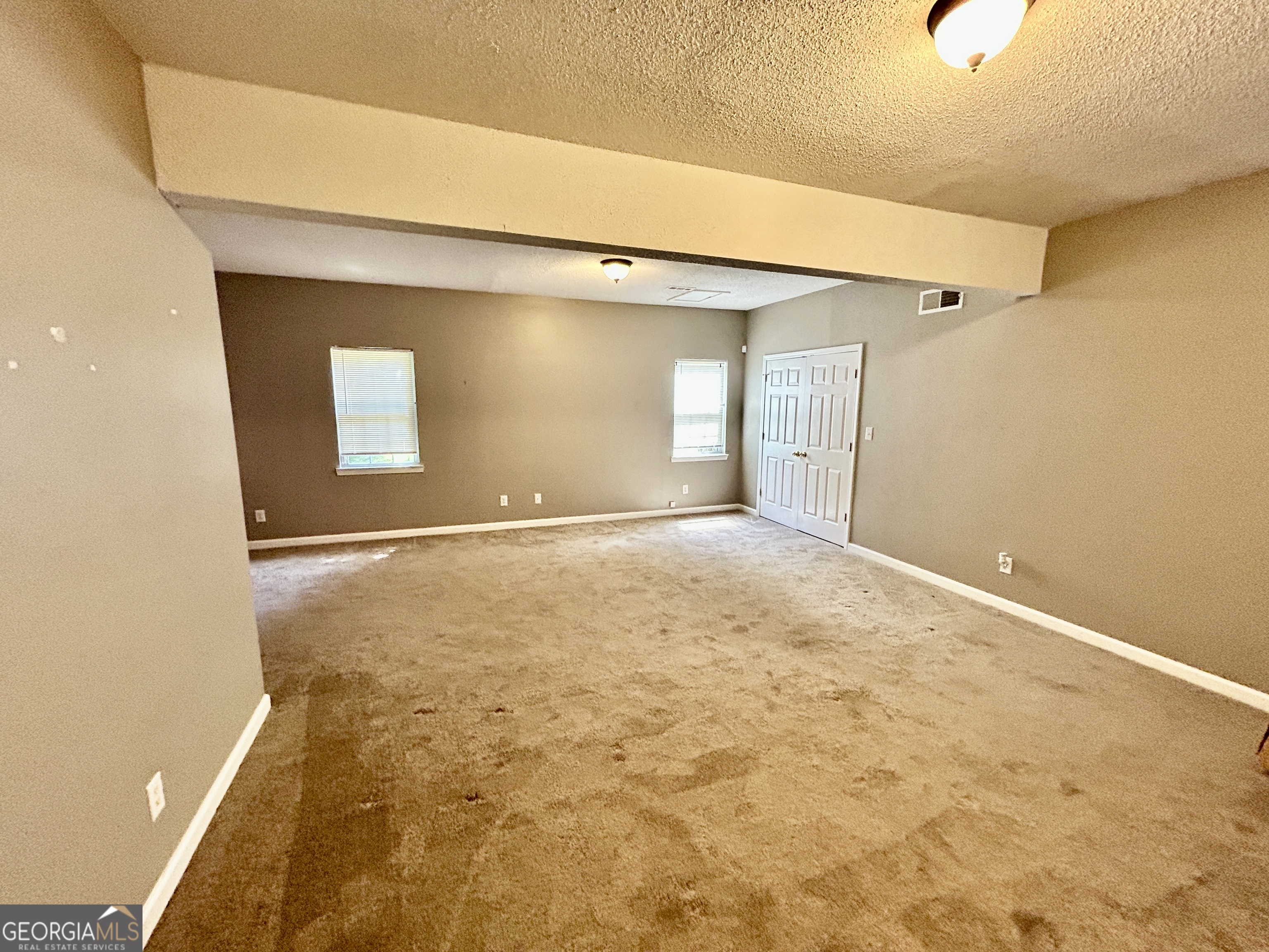 98 Pheasant Ridge Newnan, GA 30265 - Photo 20 of 23 a view of a big room with a fireplace