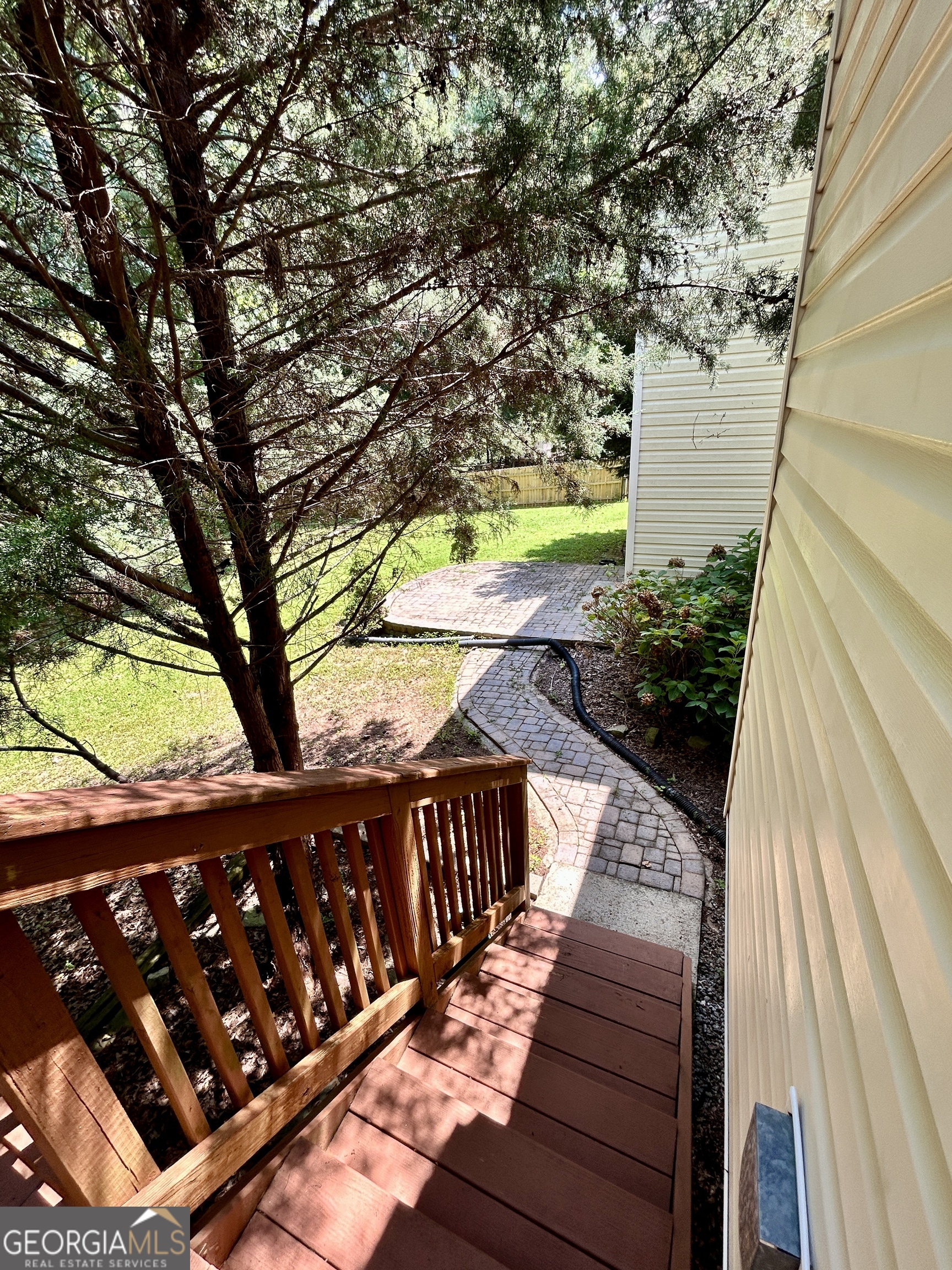 98 Pheasant Ridge Newnan, GA 30265 - Photo 23 of 23 a view of a wooden deck next to a yard
