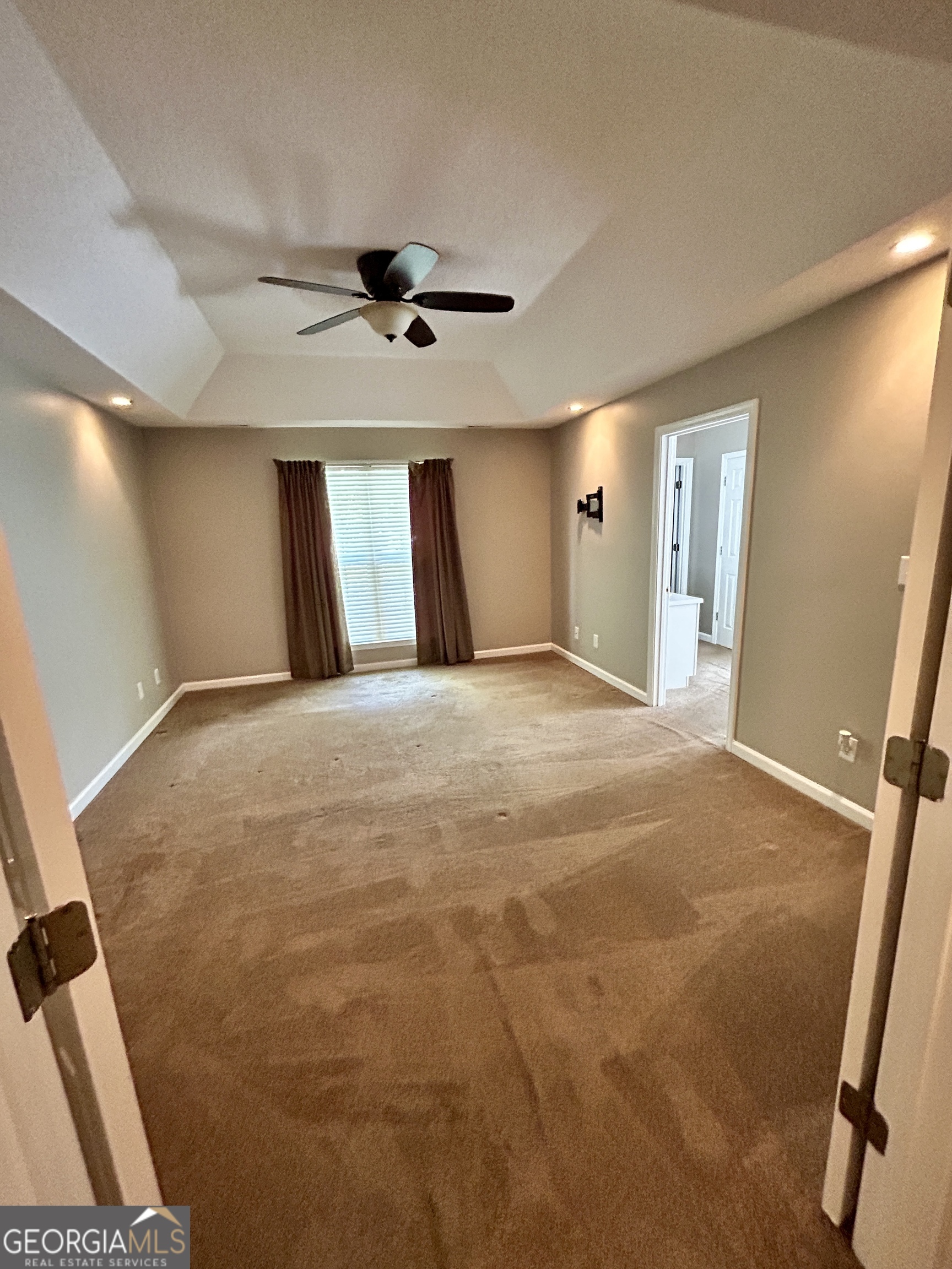 98 Pheasant Ridge Newnan, GA 30265 - Photo 10 of 23 a large room with windows and cabinet