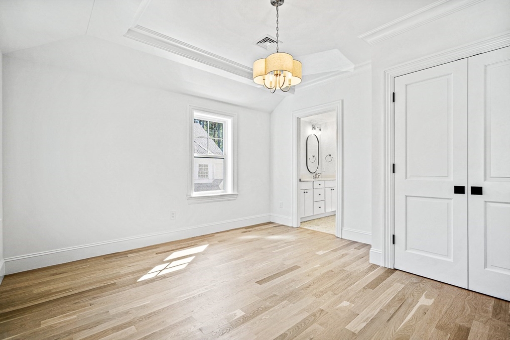 68 Parker Road Wellesley, MA 02482 - Photo 24 of 38 an empty room with wooden floor and windows