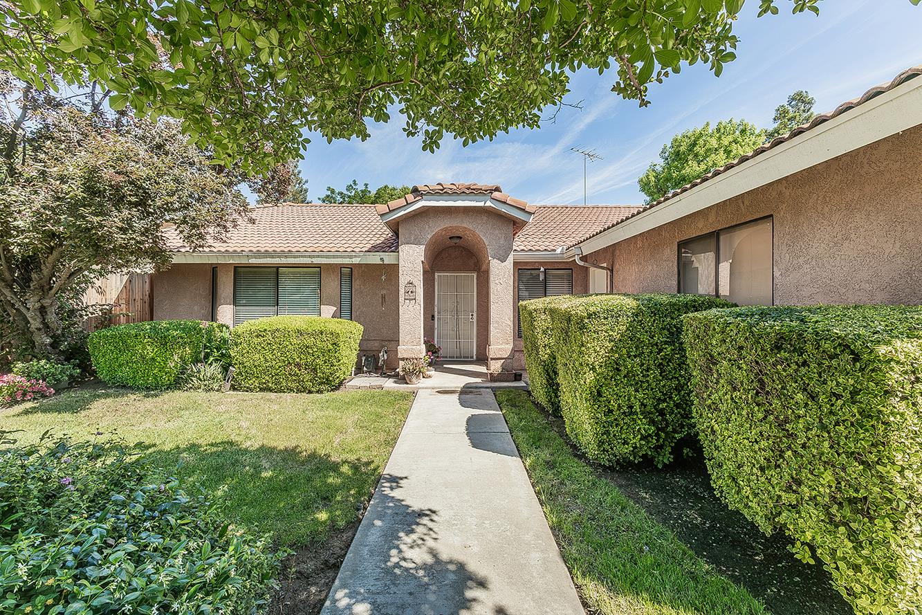 1908 East Niles Avenue Fresno, CA 93720 - Photo 2 of 30 a front view of a house with a garden