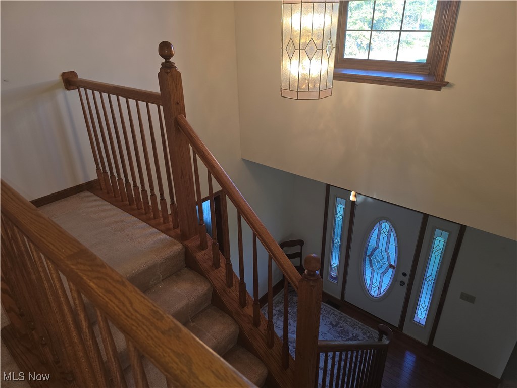 1272 Portage Line Road Akron, OH 44312 - Photo 9 of 38 Staircase with wood finished floors