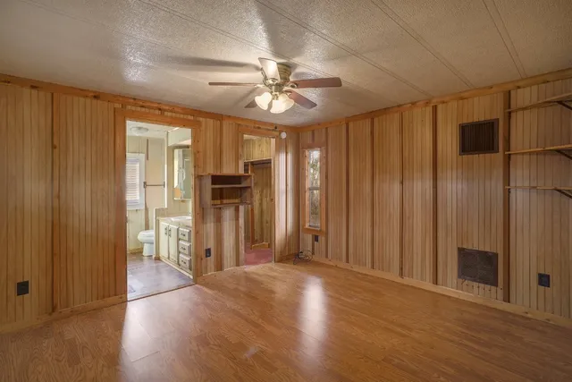a white bath tub sitting next to a window
