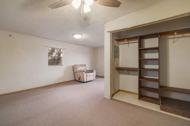 a room with window and furniture