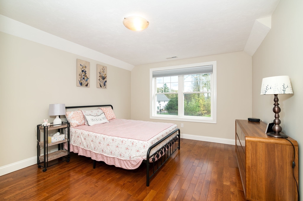 51 Tamarack Road Dracut, MA 01826 - Photo 19 of 39 a bedroom with a bed and a window