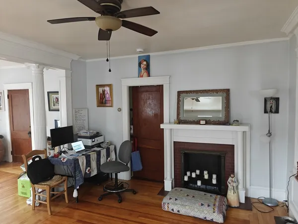 a living room with furniture and a fireplace