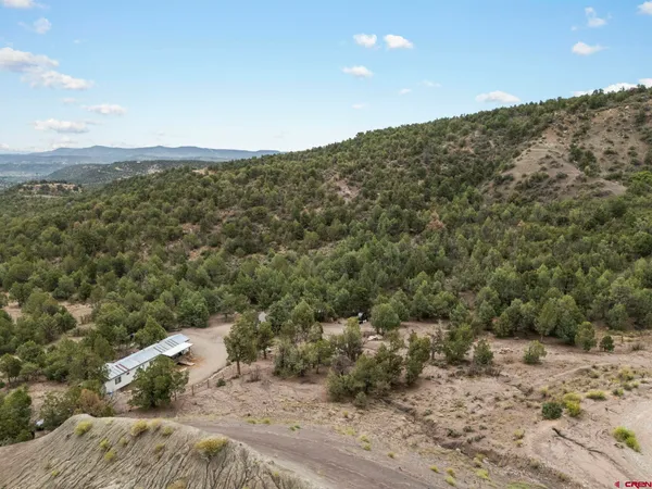 a view of a mountain with mountains in the background