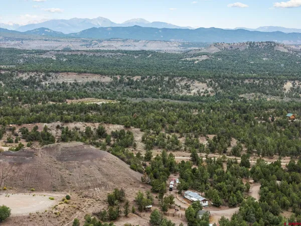 a view of a town with mountains in the background