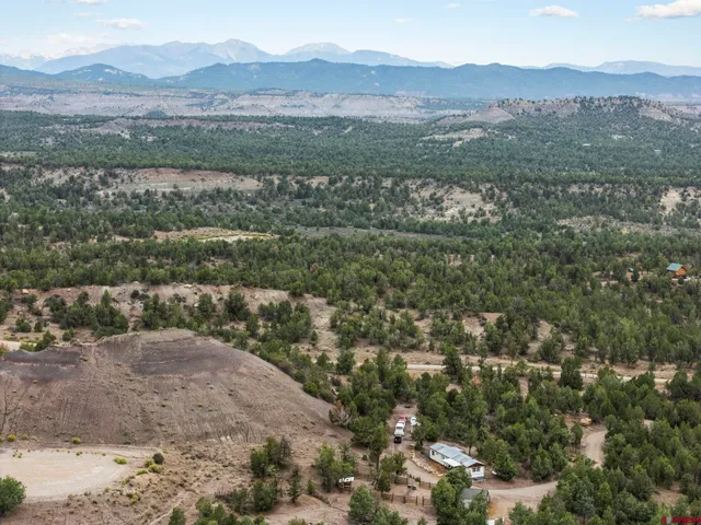 a view of a town with mountains in the background