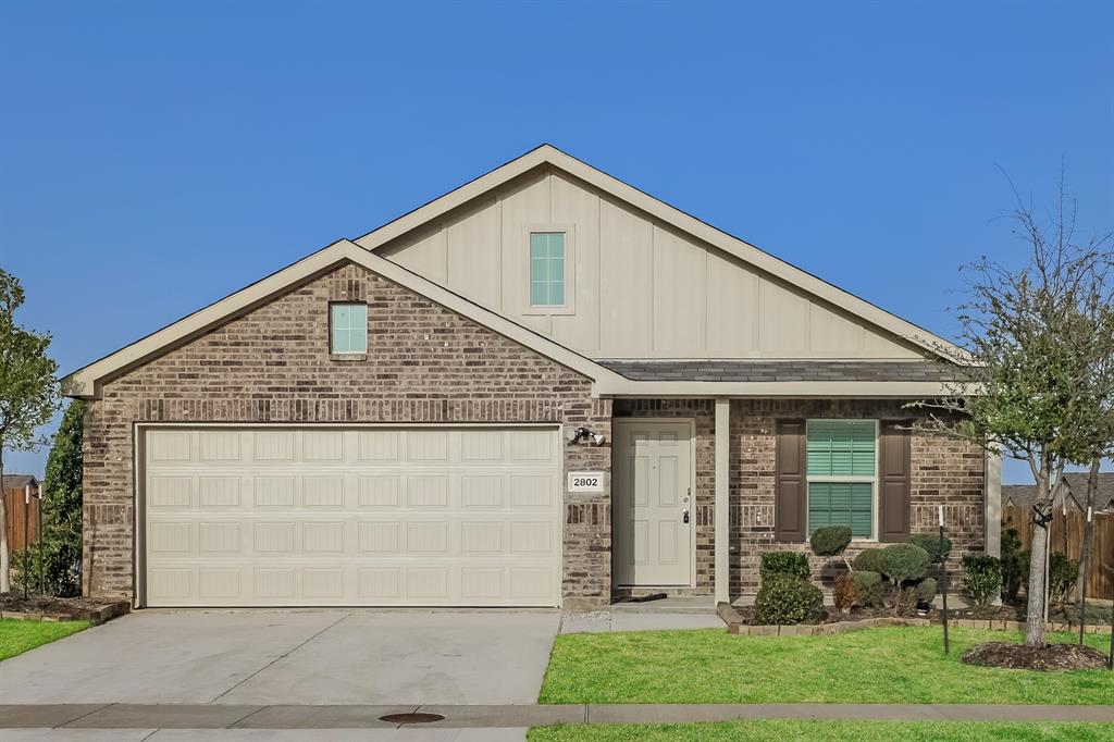 a view of a house with brick walls
