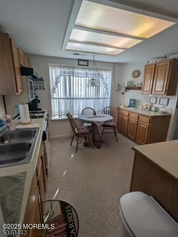 a workspace with furniture and a window