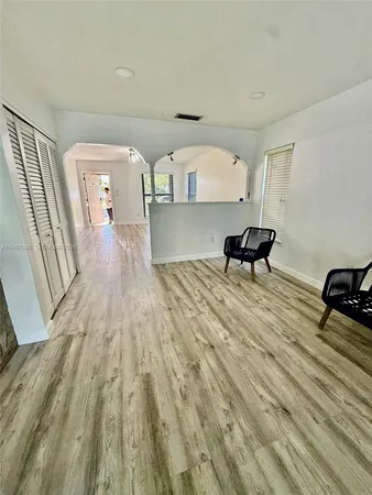a view of a living room and wooden floor