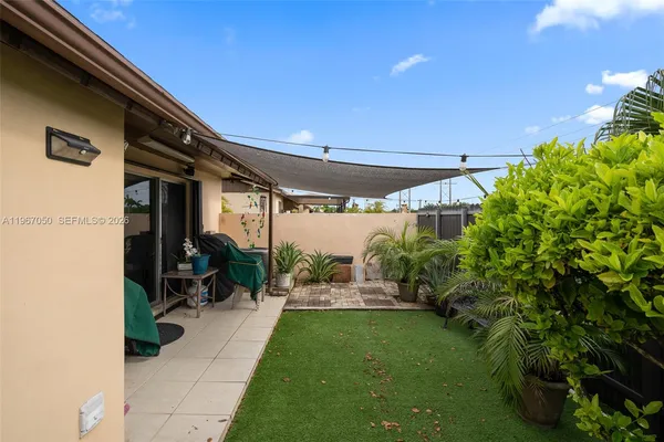 a view of yard from a corridor