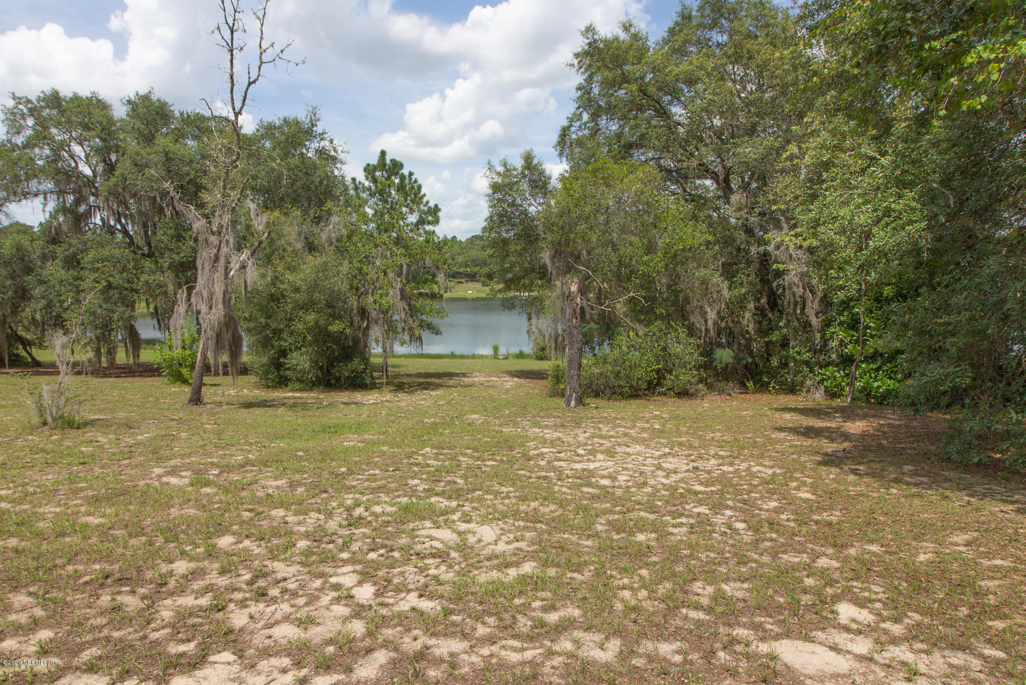6988 Deer Springs Road Keystone Heights, FL 32656 - Photo 9 of 10 a view of a yard with trees