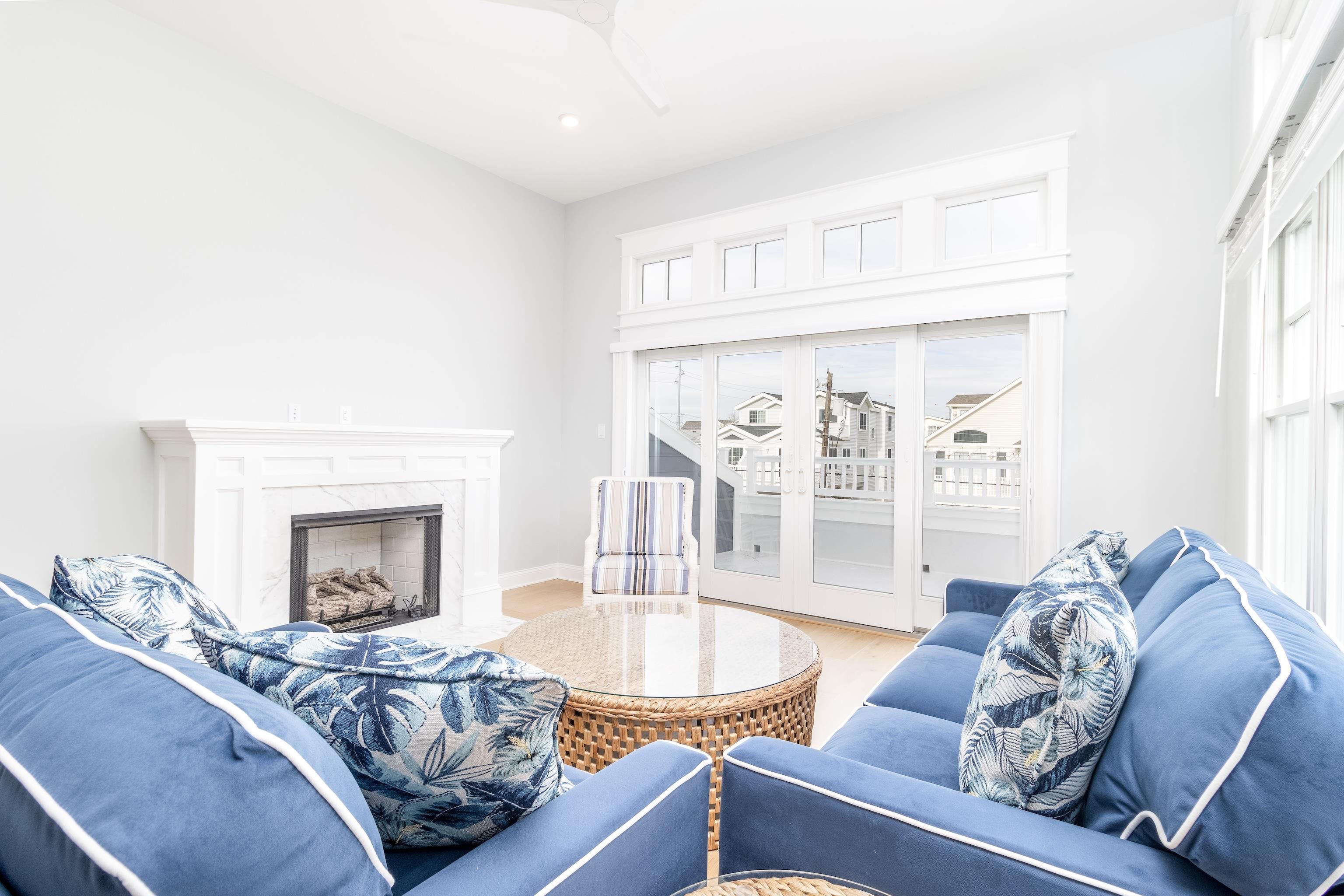 284 33rd, Unit 284 Avalon, NJ 08202 - Photo 14 of 28 a living room with furniture and a fireplace
