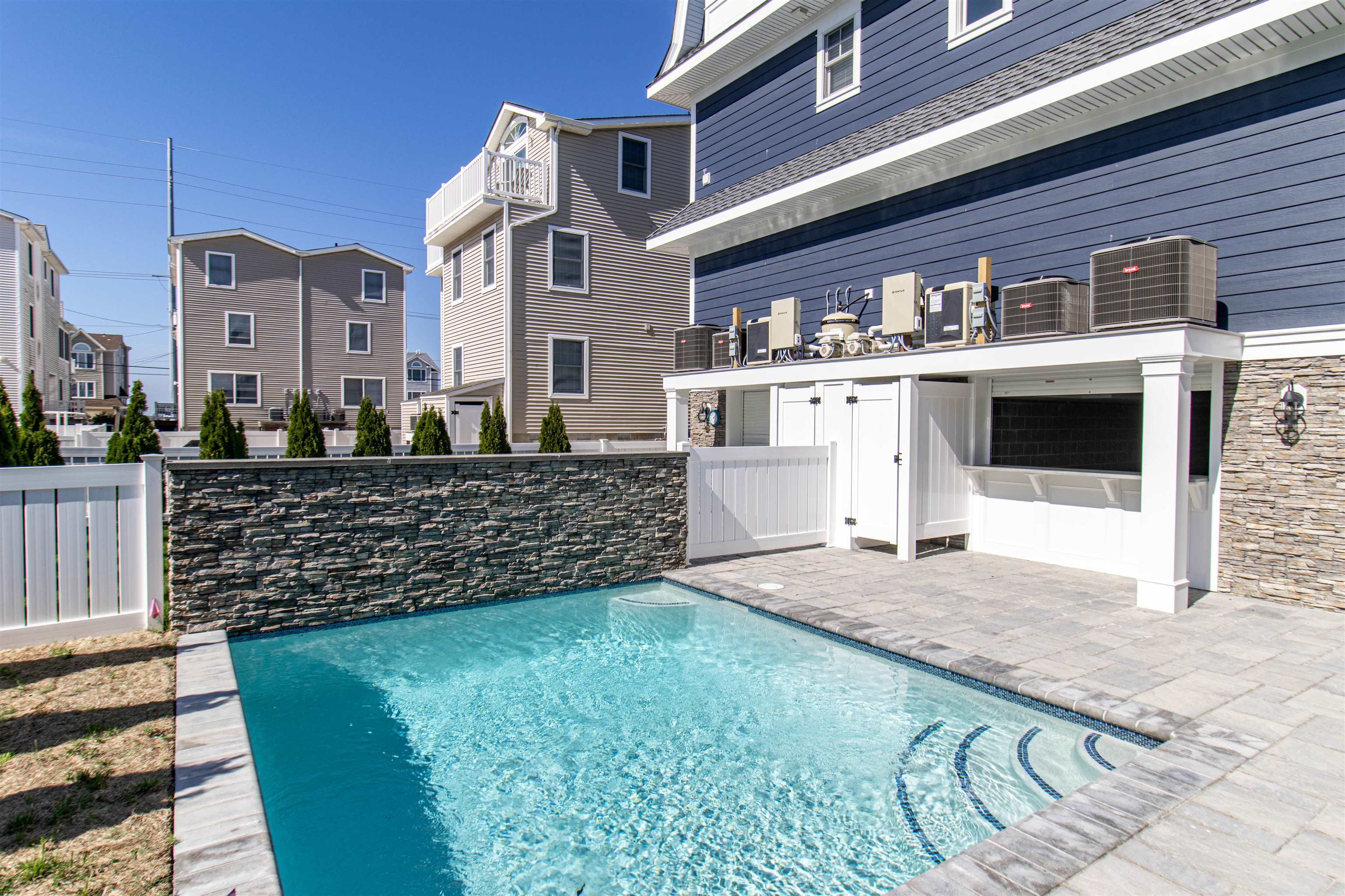 284 33rd, Unit 284 Avalon, NJ 08202 - Photo 25 of 28 a view of a brick house with large windows