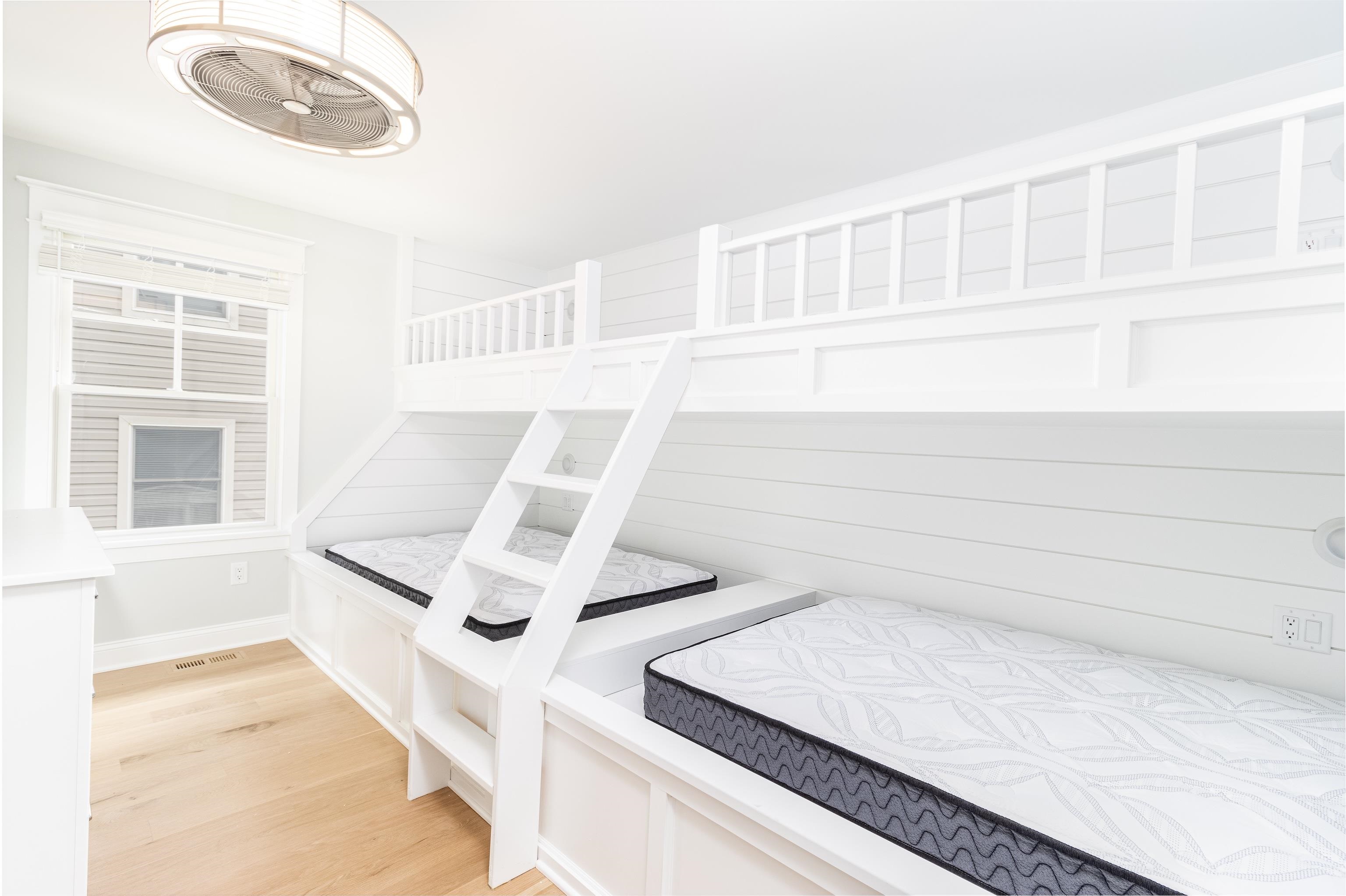 284 33rd, Unit 284 Avalon, NJ 08202 - Photo 8 of 28 a view of an empty room with wooden floor and a window