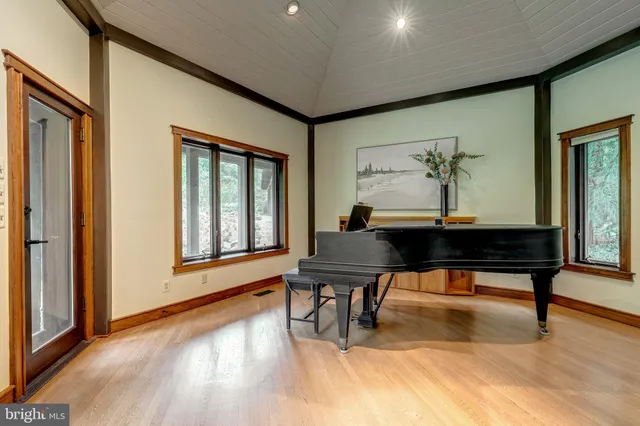 a view of a brick house with large windows