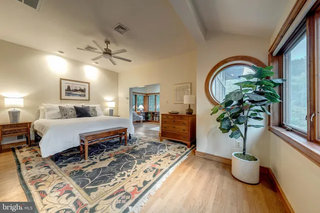 a view of a city from a dining room with furniture window and wooden floor