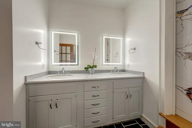 a bathroom with a shower and a sink