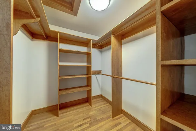 a bed room with a bed and a chair