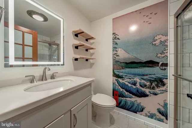 a view of a patio with table and chairs under an umbrella