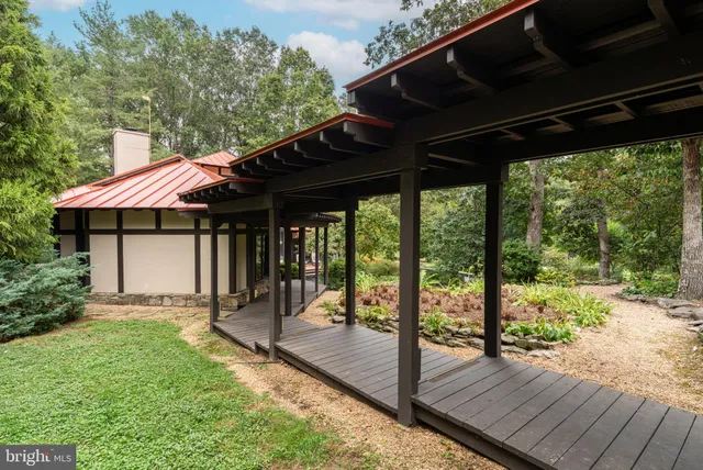a outdoor space with lots of furniture and wooden floor