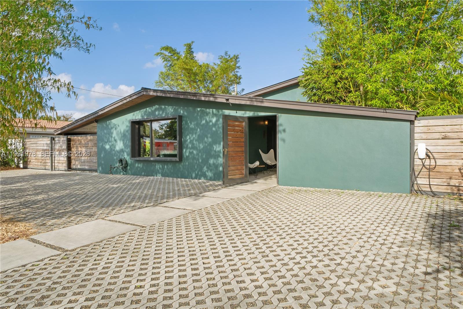 4315 Southwest 97th Court Miami, FL 33165 - Photo 1 of 17 a front view of a house with a garden