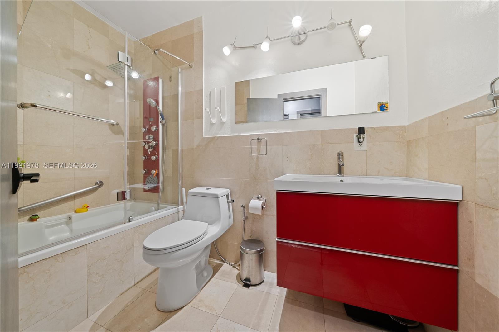 4315 Southwest 97th Court Miami, FL 33165 - Photo 11 of 17 a bathroom with a sink a toilet and shower