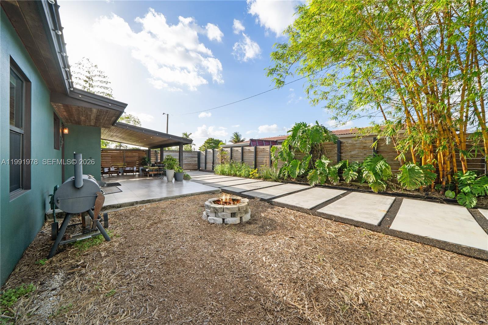 4315 Southwest 97th Court Miami, FL 33165 - Photo 14 of 17 a view of a backyard with sitting area