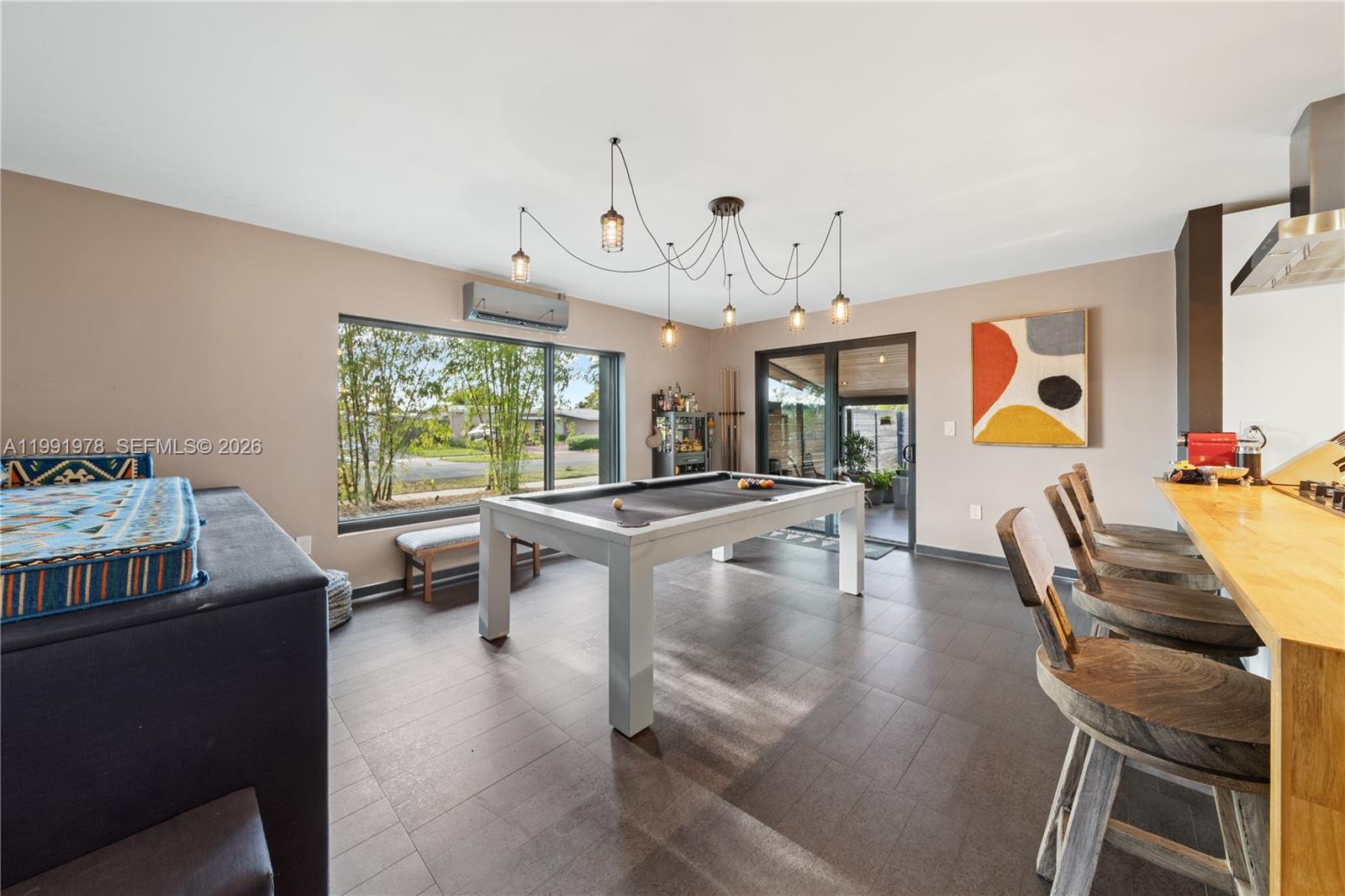 4315 Southwest 97th Court Miami, FL 33165 - Photo 3 of 17 a dining room with furniture and wooden floor