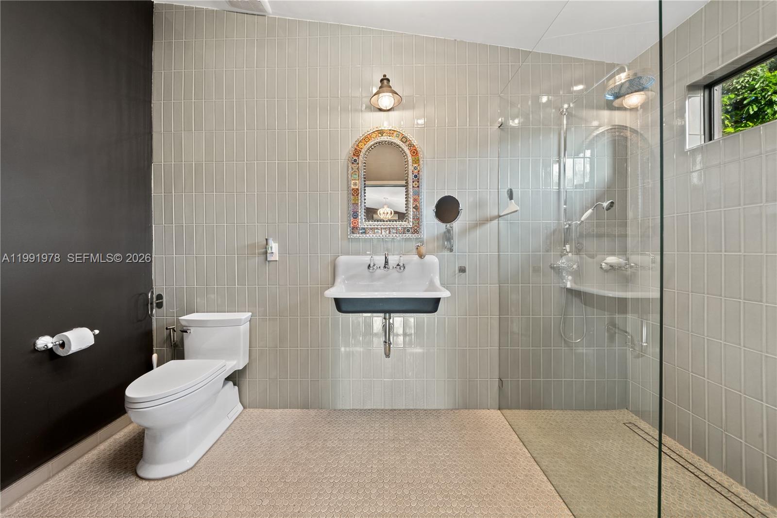 4315 Southwest 97th Court Miami, FL 33165 - Photo 10 of 17 a bathroom with a toilet sink and shower