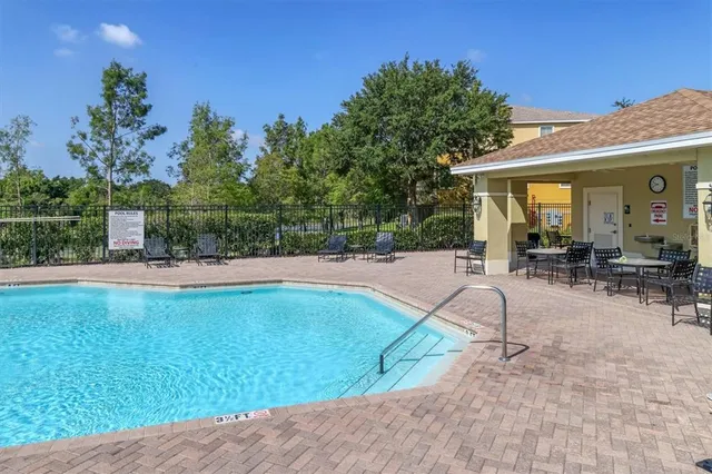 a view of a swimming pool with a patio