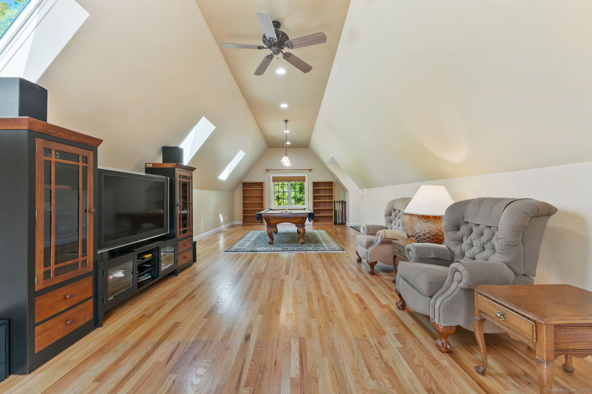 2 Longwood Drive Redding, CT 06896 - Photo 21 of 57 a living room with furniture and a flat screen tv