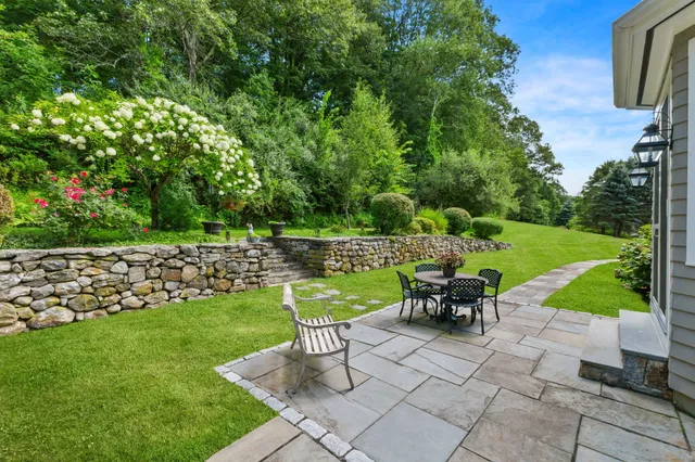 a view of a table and chairs in the garden