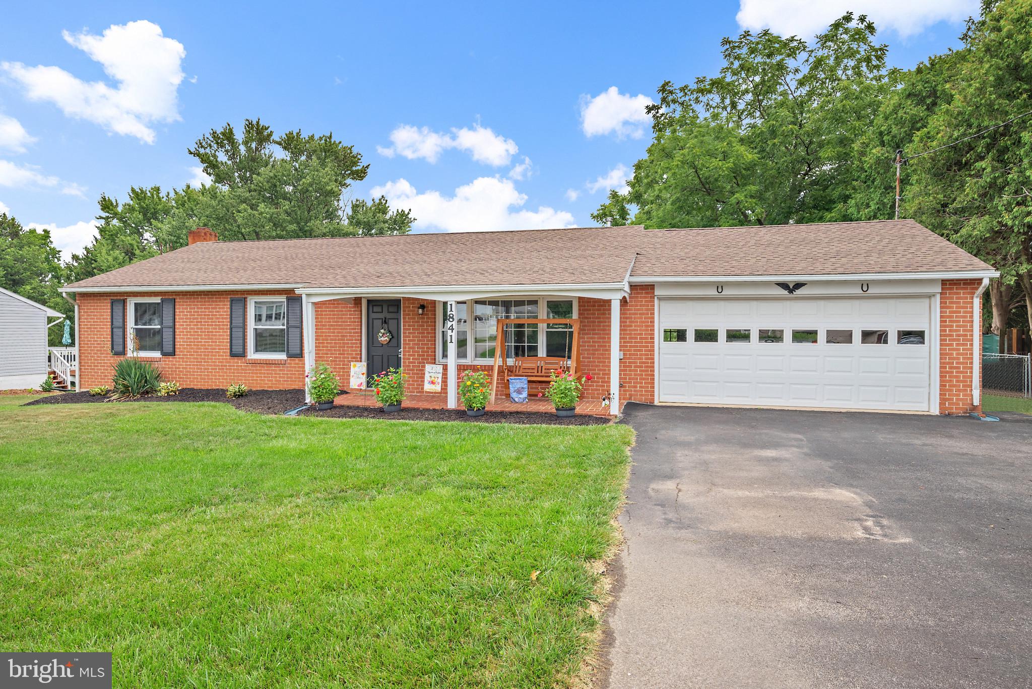 1841 Powder Mill Road York, PA 17402 - Photo 1 of 39 a view of a house with a yard potted plants and large tree