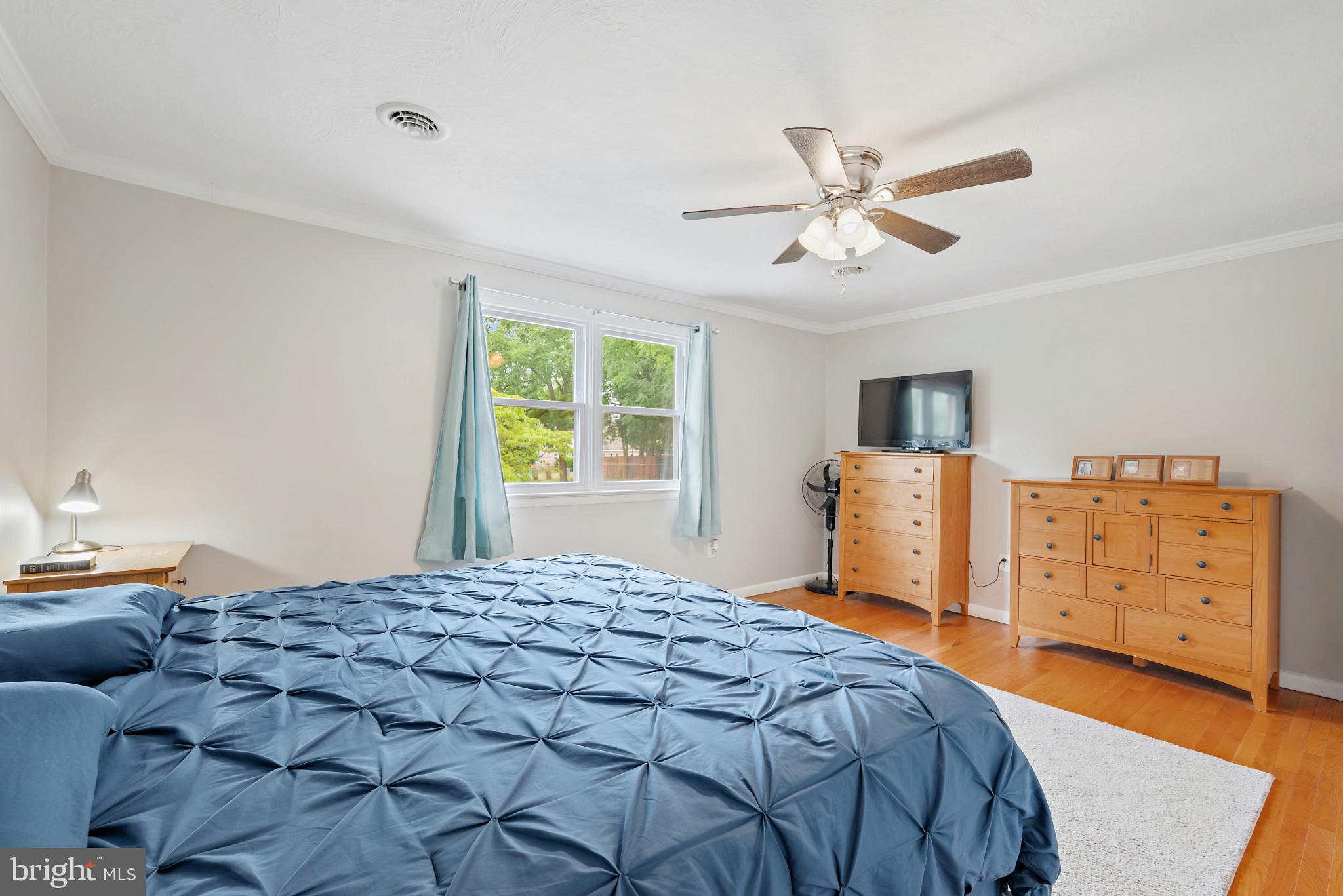 1841 Powder Mill Road York, PA 17402 - Photo 16 of 39 a bedroom with a bed and a chandelier
