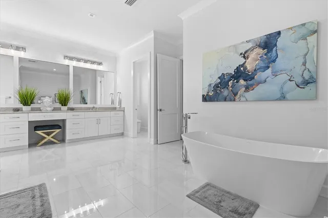 a living room with furniture wooden floor and a view of kitchen