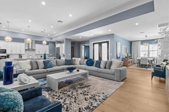 a view of a balcony with dining table and chairs with wooden floor