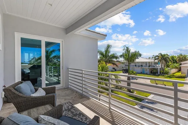 an aerial view of multiple houses with a yard