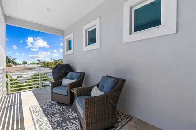 a large kitchen with a center island appliances and cabinets