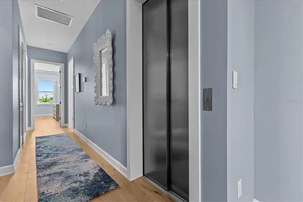 a bathroom with a granite countertop sink a mirror and a vanity