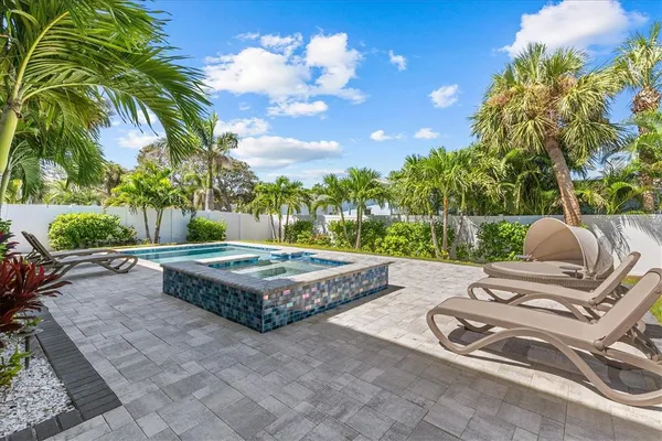 an aerial view of a houses and an outdoor space