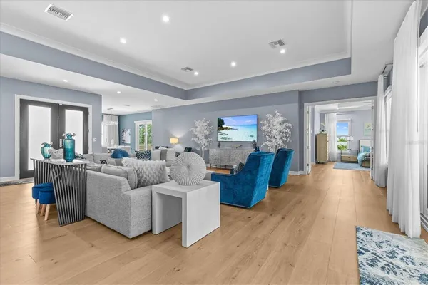 a living room with furniture and a large window