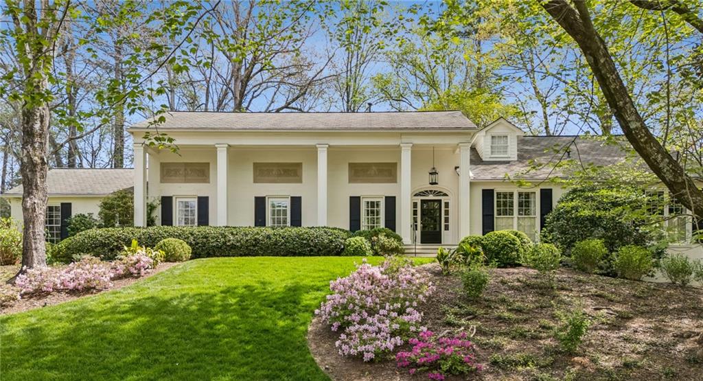 2605 Red Valley Road Northwest Atlanta, GA 30305 - Photo 1 of 1 a front view of a house with garden and trees
