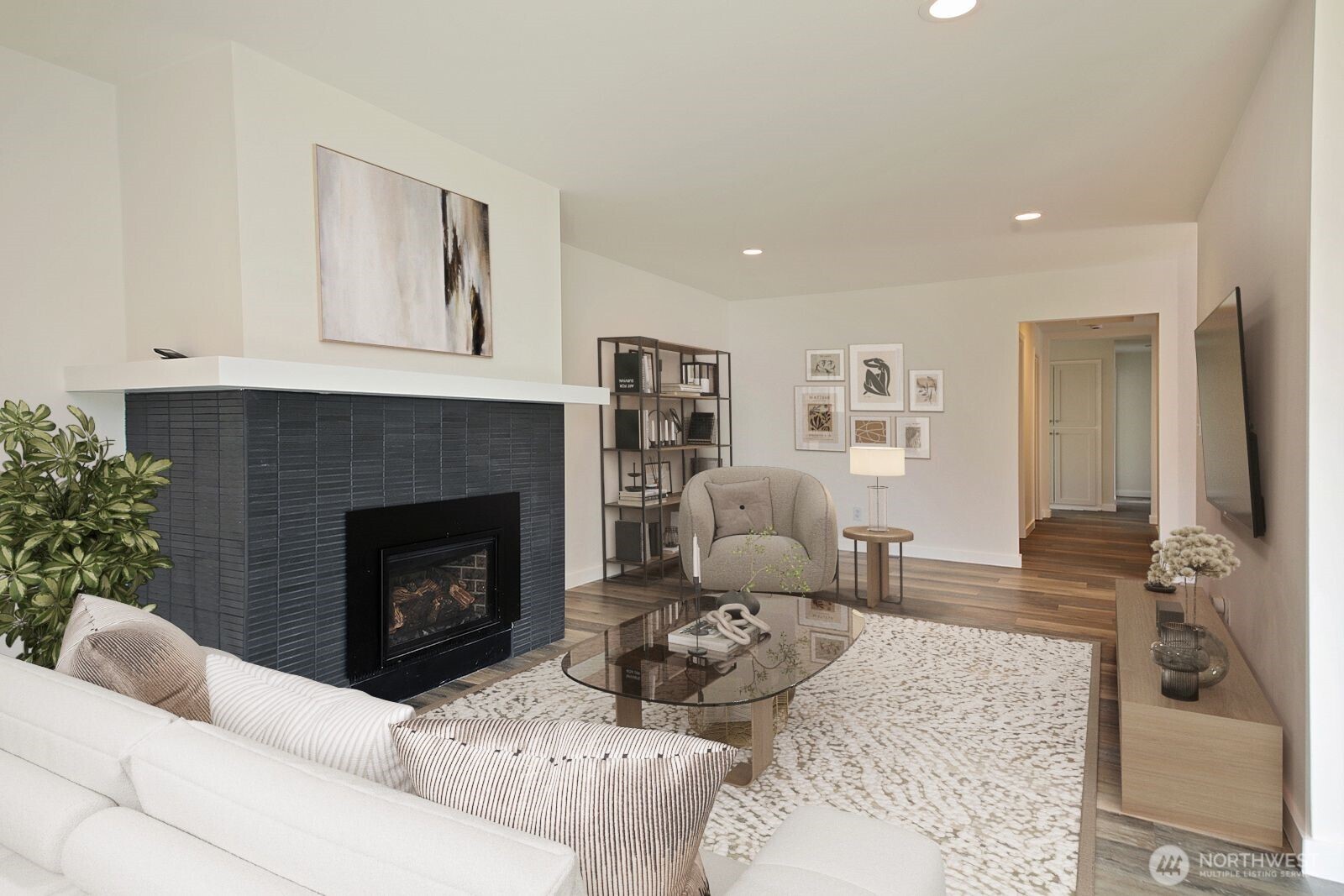 3760 Periwinkle Road Clinton, WA 98236 - Photo 18 of 34 a living room with furniture and a fireplace