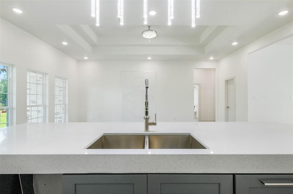 2291 Riverside Drive West Columbia, TX 77486 - Photo 23 of 50 a kitchen with a sink and white cabinets